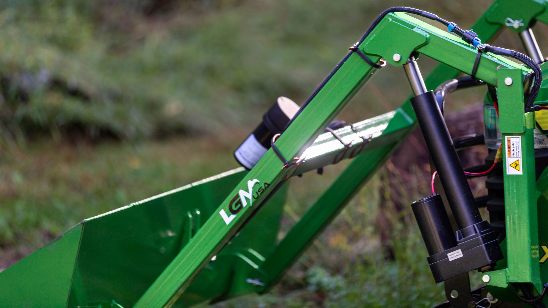 LGM-100 electric front-end loader with linear actuators