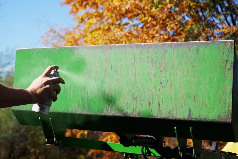 Spray painting to protect the metal from corrosion.