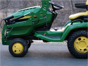 LGM-100 scooping mulch with a John Deere X500 lawn tractor